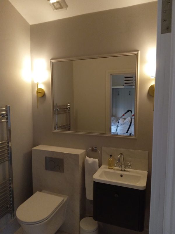 Custom Bathroom and Bedroom Mirror Installation - Image 3
